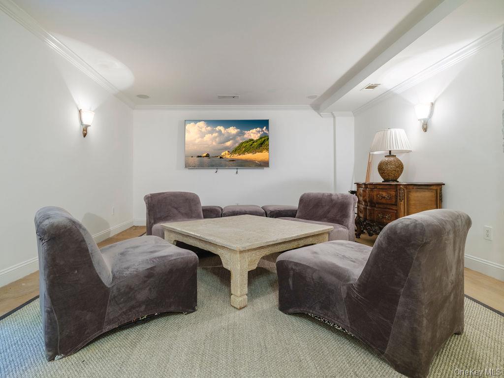 3875 Hallock Lane Mattituck, NY 11952 - Photo 35 of 50 Sitting room featuring crown molding and wood finished floors