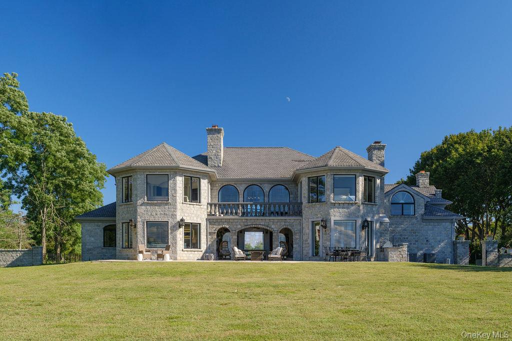 3875 Hallock Lane Mattituck, NY 11952 - Photo 5 of 50 Back of house with a balcony, a yard, and a chimney