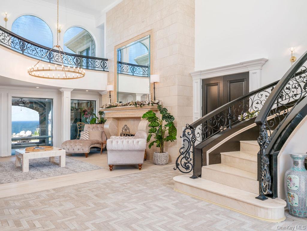 3875 Hallock Lane Mattituck, NY 11952 - Photo 8 of 50 Lobby with stairway, a high ceiling, and crown molding