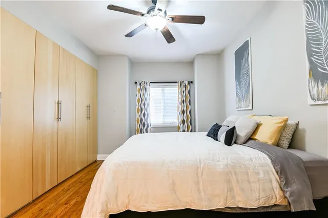 a bedroom with a bed and a window