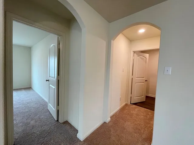 a view of a bathroom from a hallway