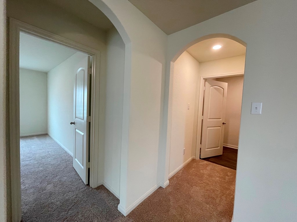 168 Allington Circle Jarrell, TX 76537 - Photo 14 of 40 a view of a bathroom from a hallway
