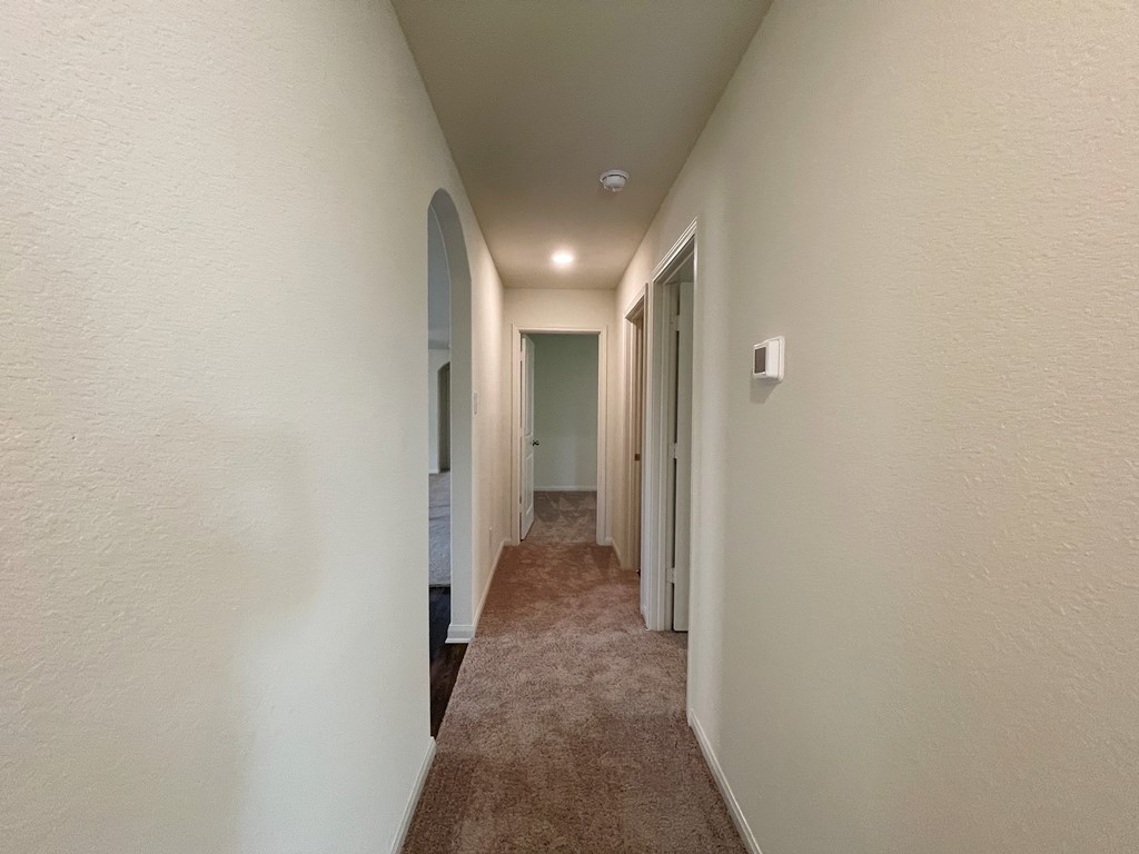168 Allington Circle Jarrell, TX 76537 - Photo 27 of 40 a view of a hallway with a room
