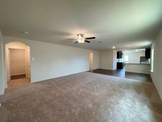 a view of a kitchen with a sink and a chandelier