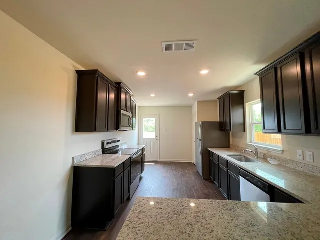 a large bathroom with a large mirror vanity and sink