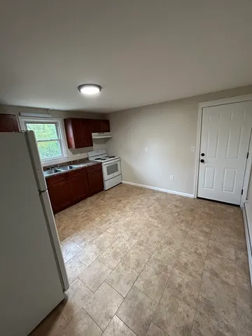 a view of kitchen and a window