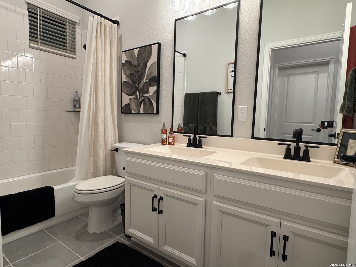 142 Willamette Way Kyle, TX 78640 - Photo 24 of 29 a bathroom with a sink toilet and shower