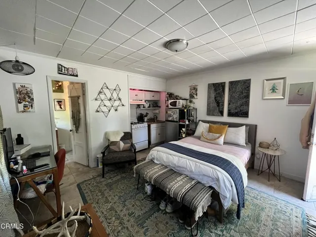 a bedroom with a bed and furniture