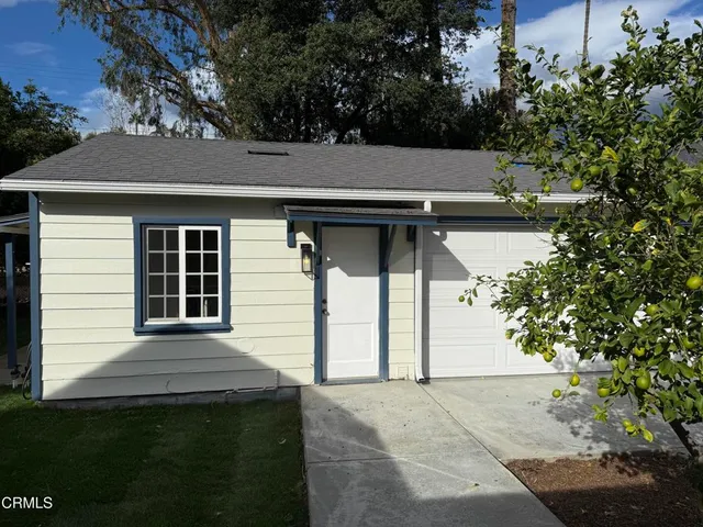 a front view of a house with garage