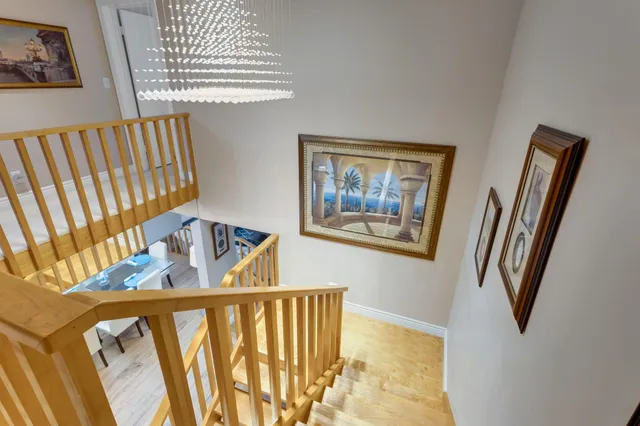 a view of an entryway with wooden floor