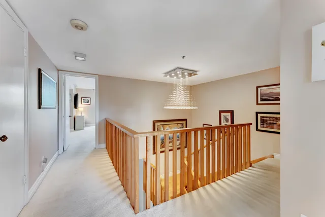 a view of a hallway with a bathtub