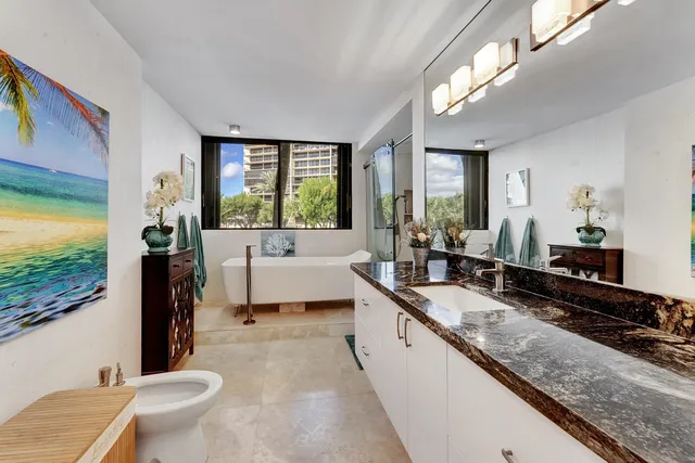 a bathroom with a bathtub and window