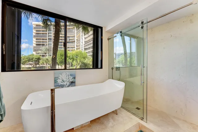 a view of a chairs and table in the balcony