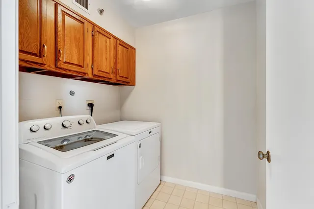 a view of a livingroom with furniture and next to a window