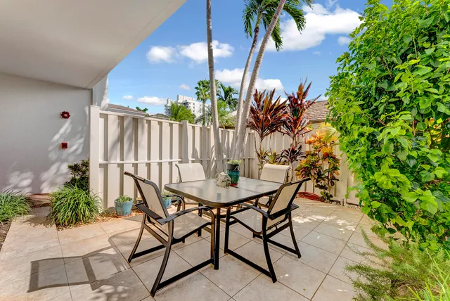 a view of a chairs and table in the patio