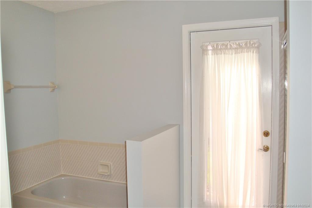 2209 Southwest Oak Ridge Road Palm City, FL 34990 - Photo 26 of 35 2nd bathroom has an outside door