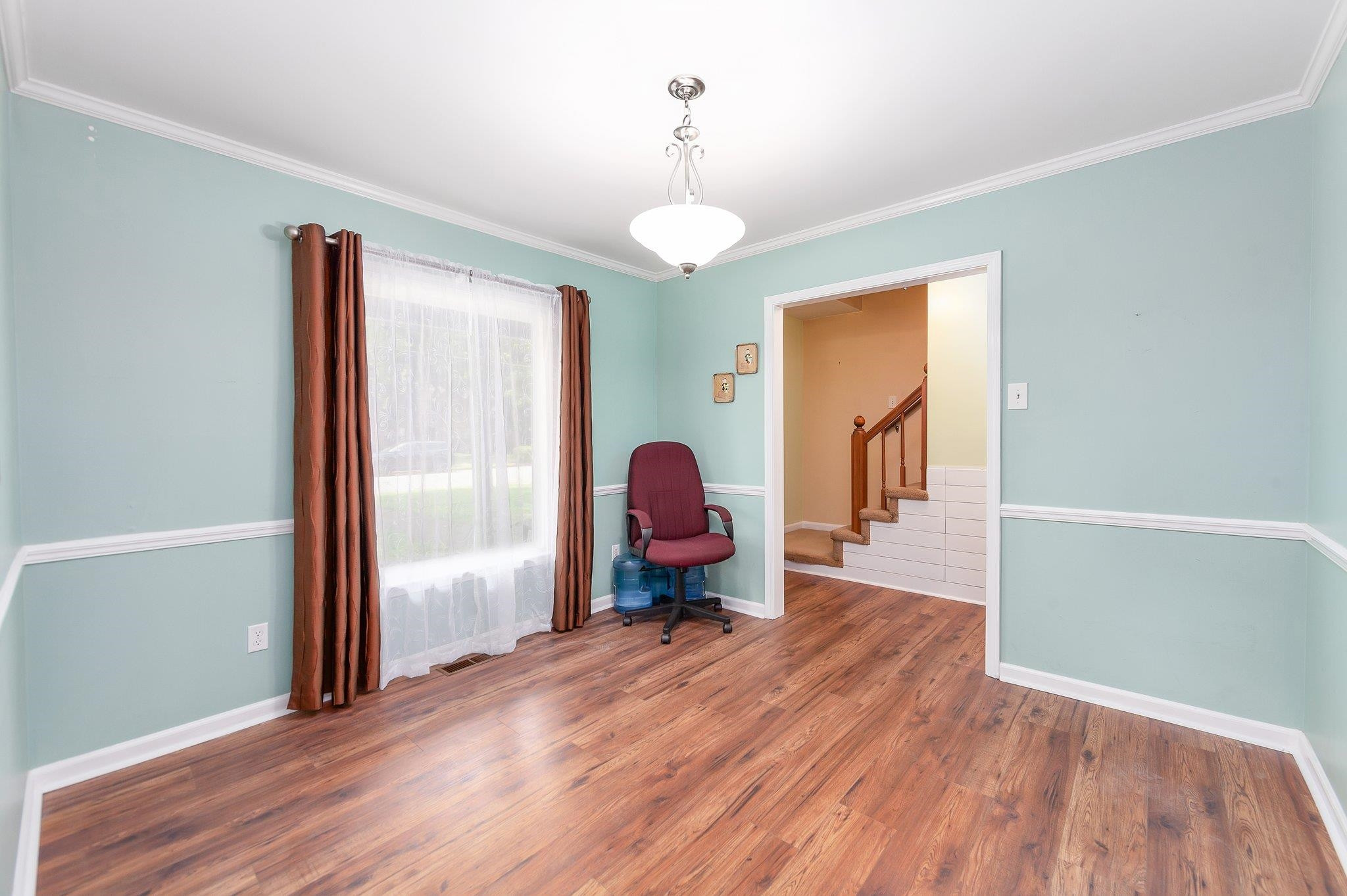 56 Ridgeoak Place Jackson, TN 38305 - Photo 13 of 34 a view of a room with wooden floor table and a chandelier