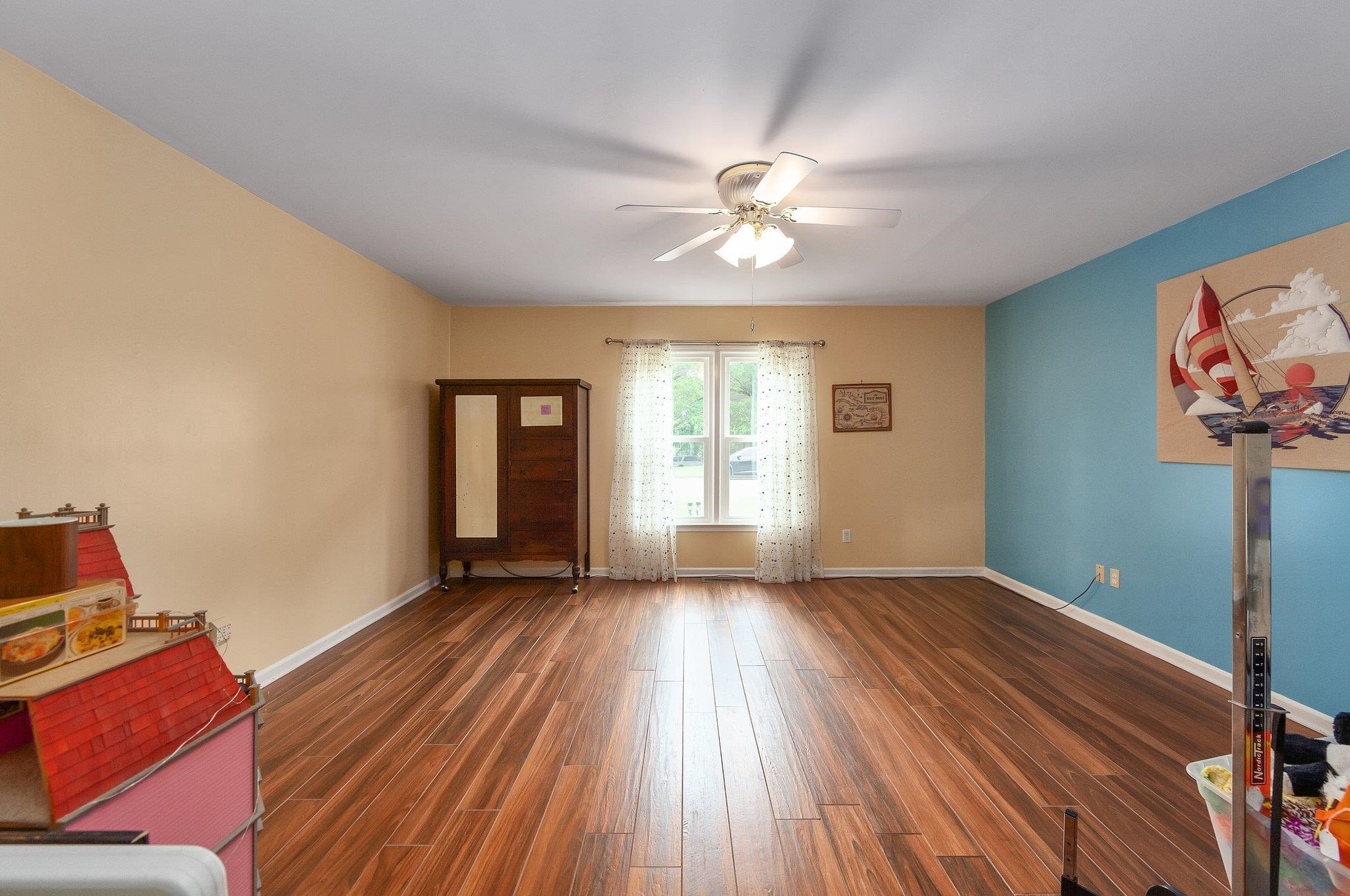 56 Ridgeoak Place Jackson, TN 38305 - Photo 18 of 34 a view of an empty room with a window and wooden floor