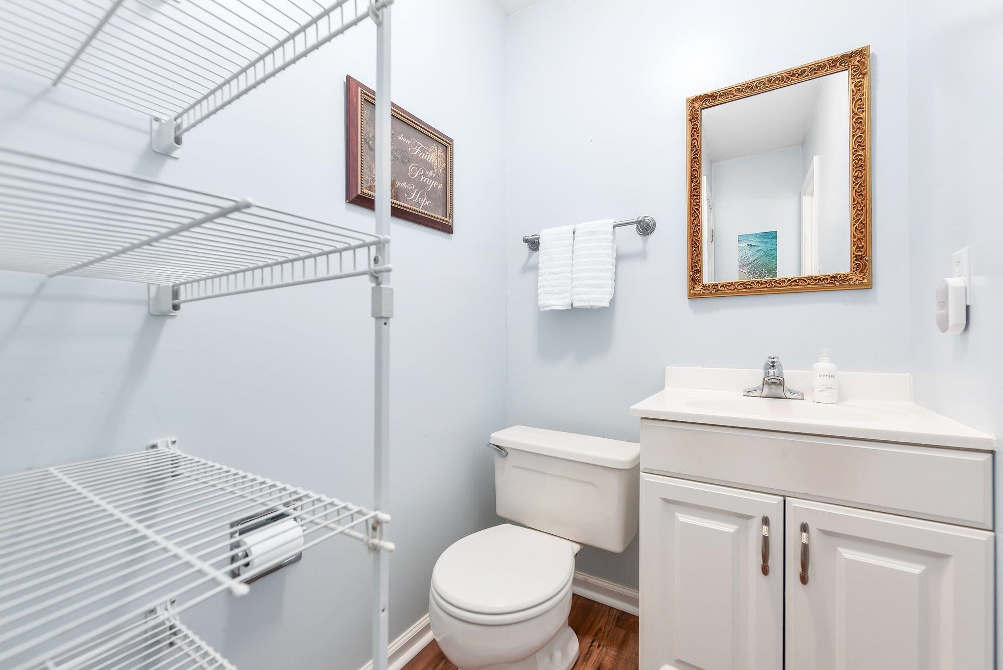 56 Ridgeoak Place Jackson, TN 38305 - Photo 23 of 34 a bathroom with a toilet sink vanity and mirror