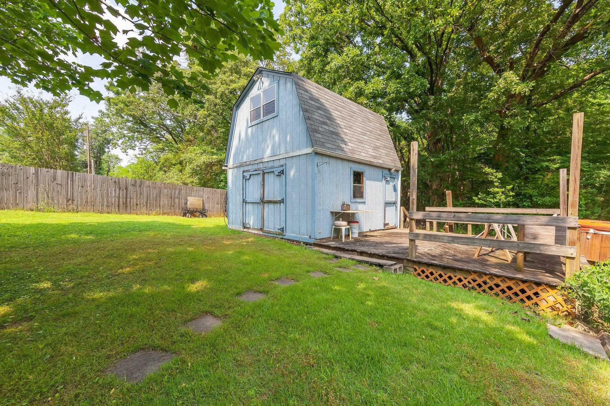 56 Ridgeoak Place Jackson, TN 38305 - Photo 29 of 34 a view of a house with backyard and a small cabin