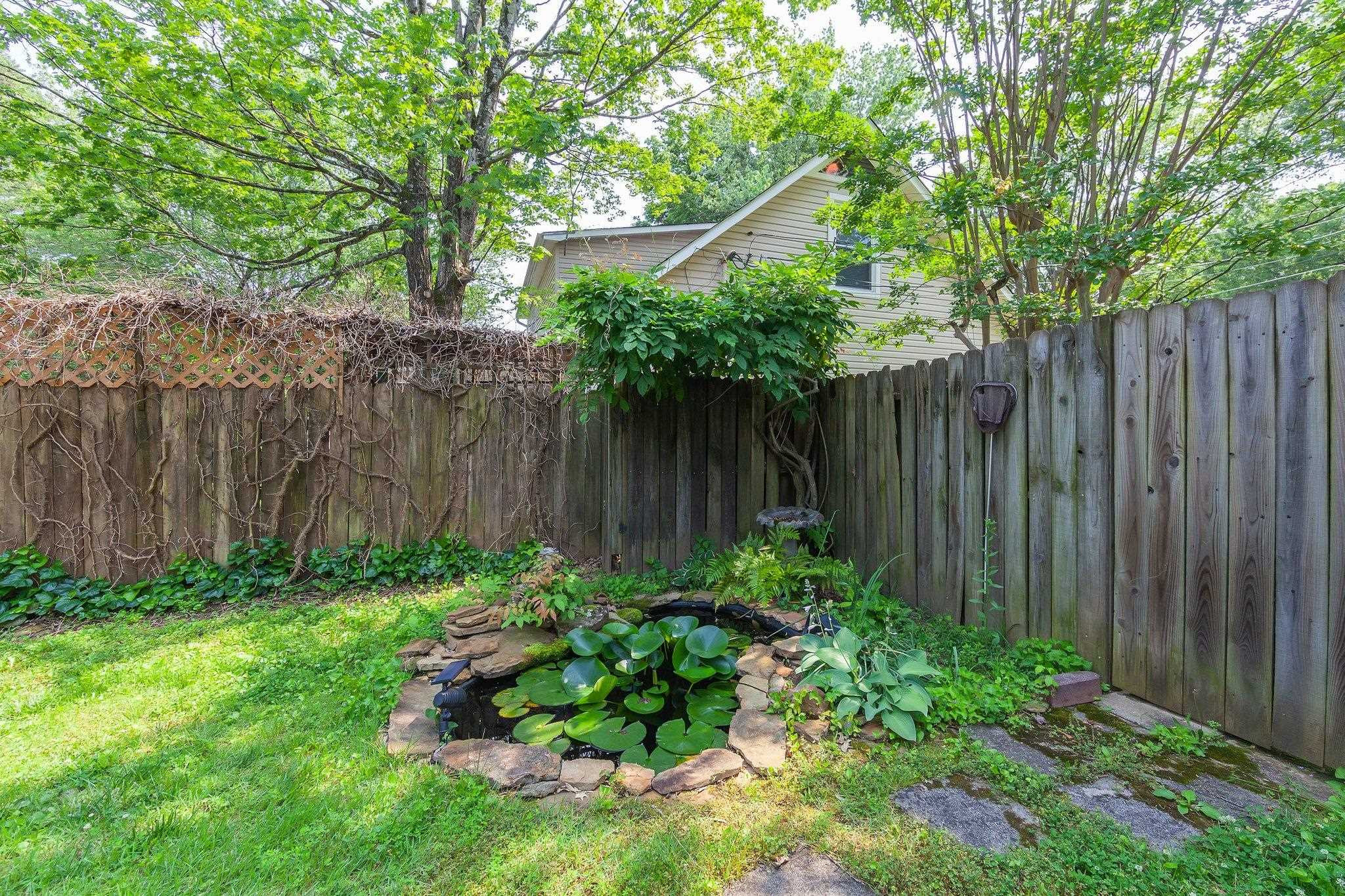 56 Ridgeoak Place Jackson, TN 38305 - Photo 31 of 34 a garden covered with wooden fence