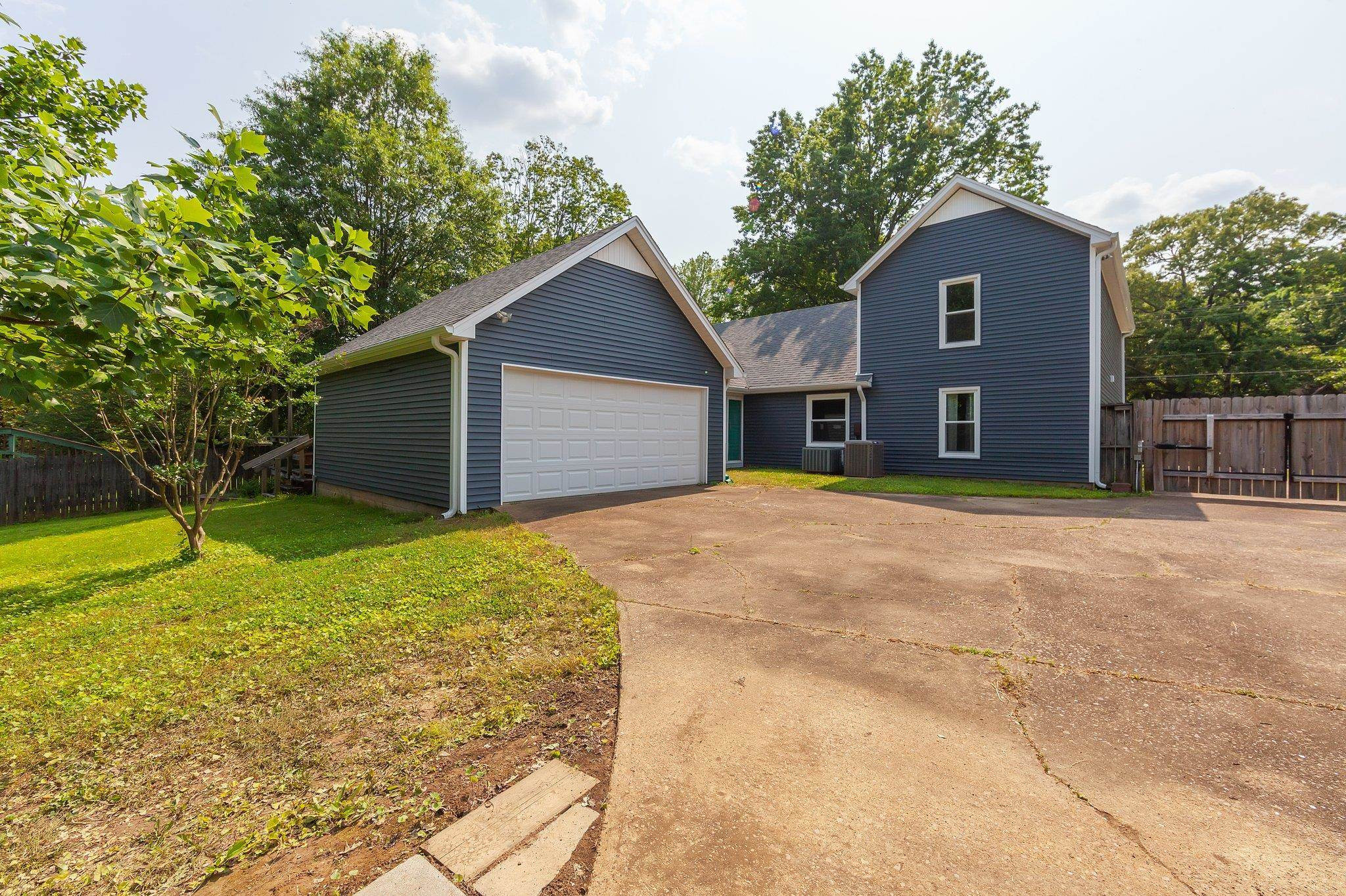 56 Ridgeoak Place Jackson, TN 38305 - Photo 34 of 34 a front view of a house with yard and trees