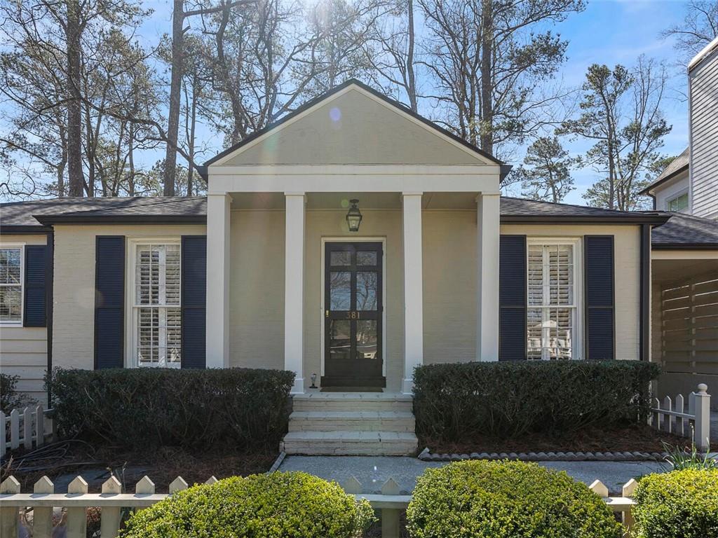 381 Pine Forest Road Northeast Atlanta, GA 30342 - Photo 1 of 1 a front view of a house with a yard