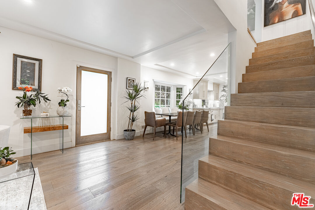 1438 San Ysidro Drive Beverly Hills, CA 90210 - Photo 20 of 40 a living room with furniture and wooden floor