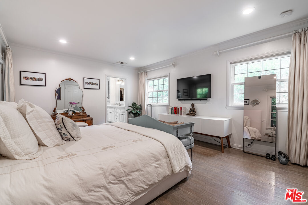 1438 San Ysidro Drive Beverly Hills, CA 90210 - Photo 23 of 40 a bedroom with bed and a flat screen tv