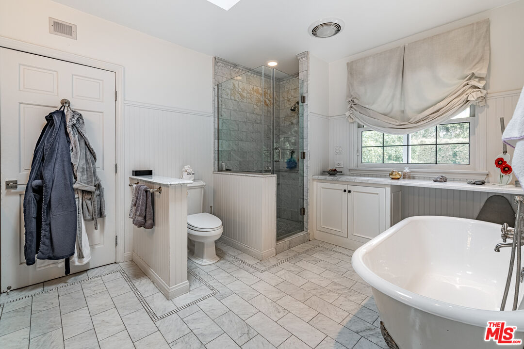 1438 San Ysidro Drive Beverly Hills, CA 90210 - Photo 26 of 40 a bathroom with a sink a toilet and shower