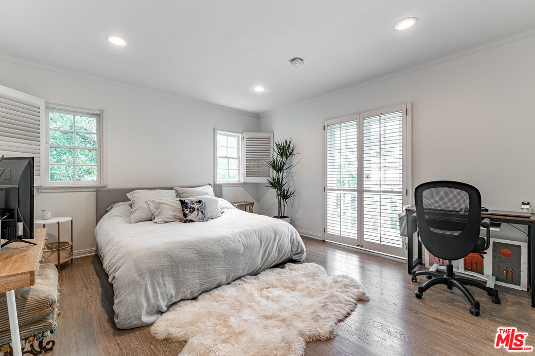 1438 San Ysidro Drive Beverly Hills, CA 90210 - Photo 28 of 40 a bedroom with bed and a large window