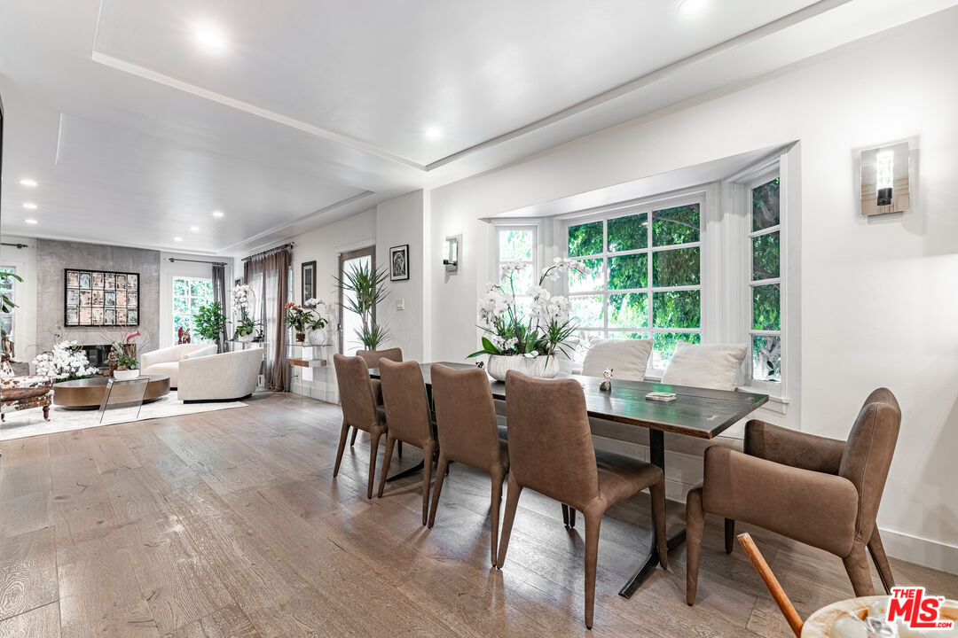 1438 San Ysidro Drive Beverly Hills, CA 90210 - Photo 3 of 40 a view of a dining room with furniture window and outside view
