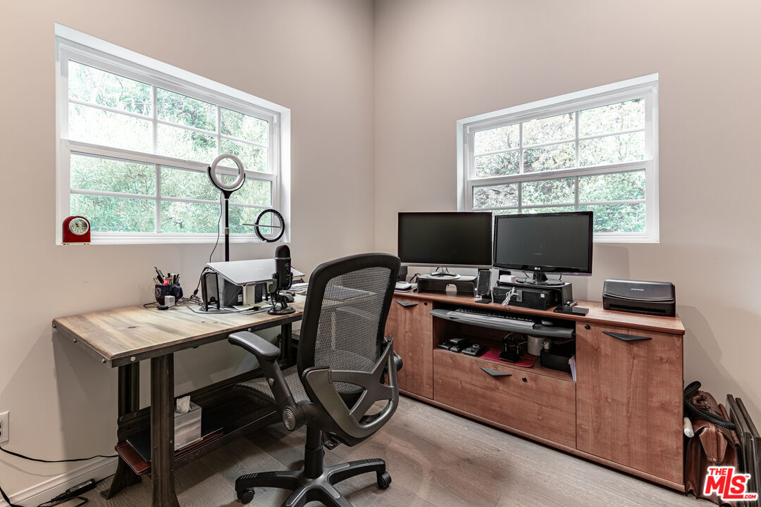 1438 San Ysidro Drive Beverly Hills, CA 90210 - Photo 32 of 40 a view of a workspace with furniture and a window