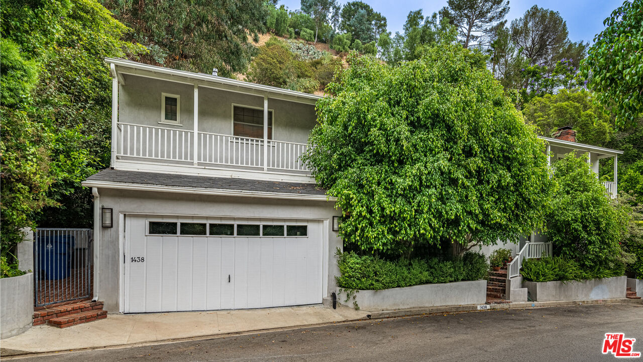 1438 San Ysidro Drive Beverly Hills, CA 90210 - Photo 40 of 40 a front view of a house with a yard