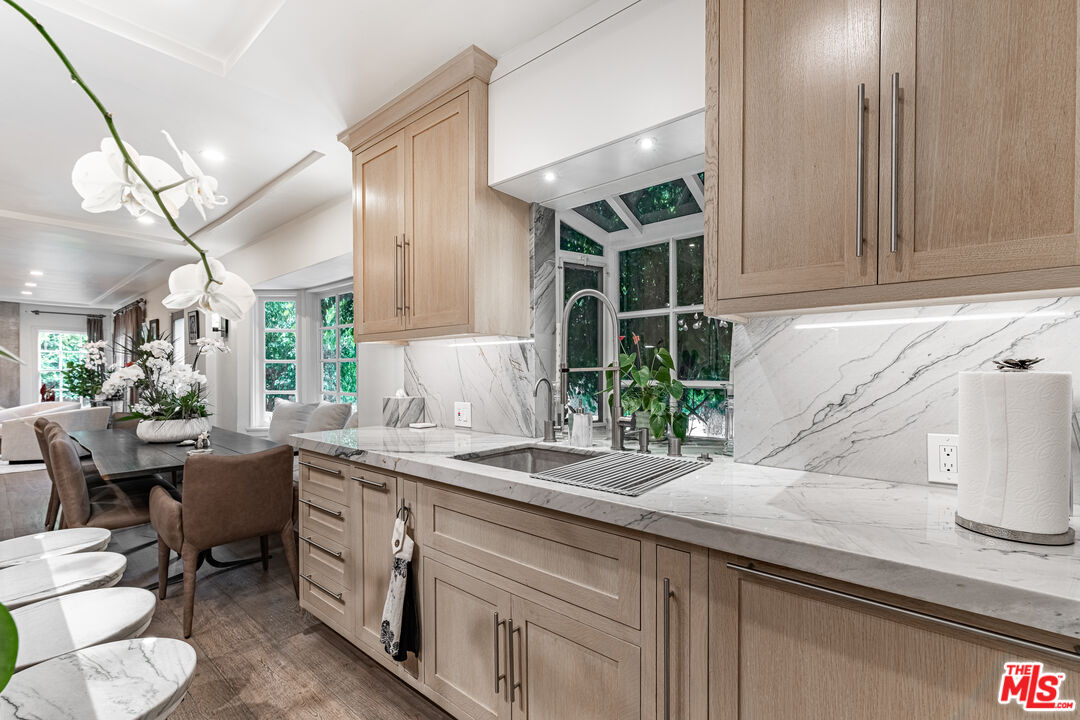 1438 San Ysidro Drive Beverly Hills, CA 90210 - Photo 6 of 40 a kitchen with a sink and a window
