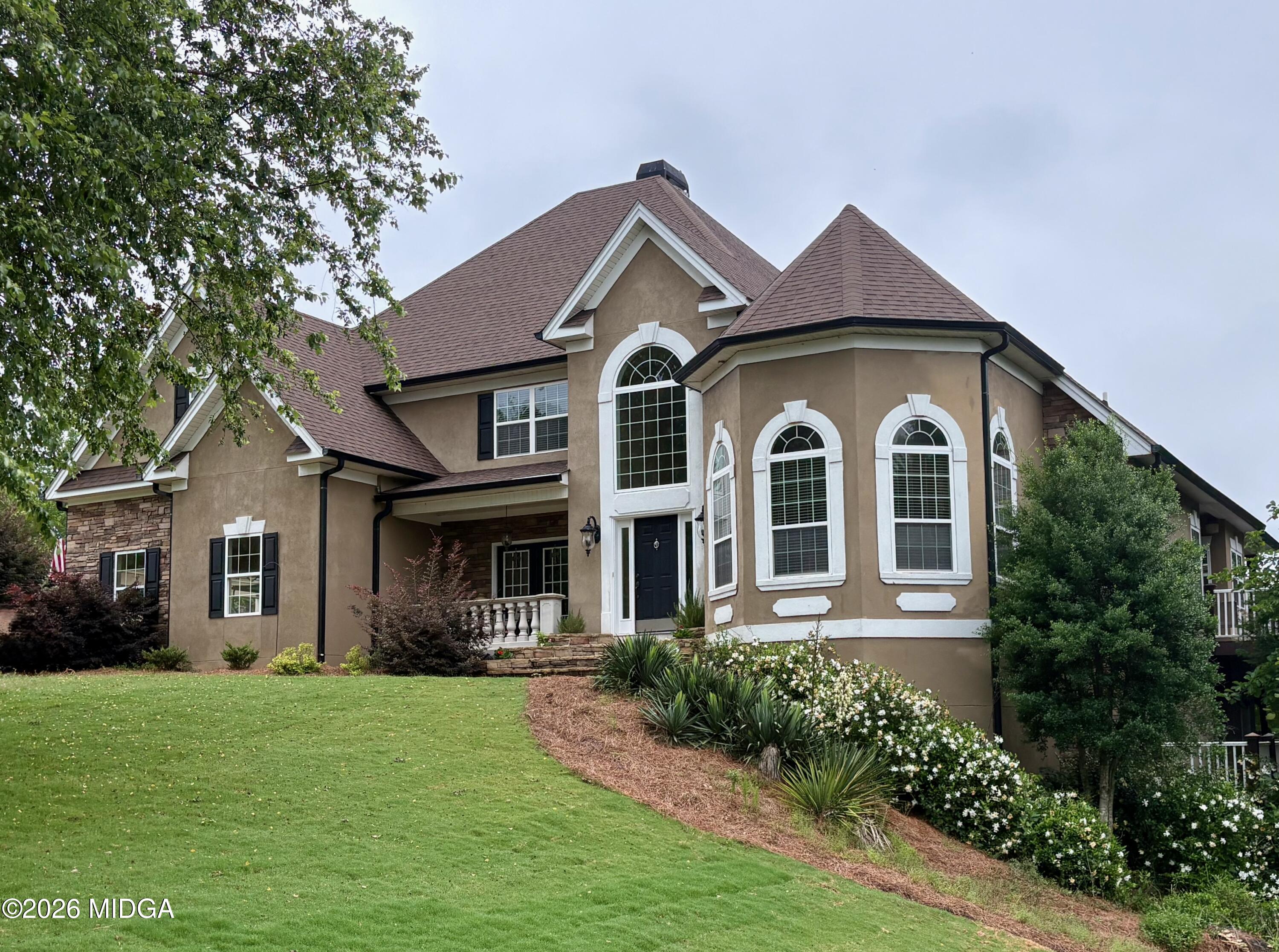 518 River Overlook Forsyth, GA 31029 - Photo 1 of 96 a front view of a house with garden