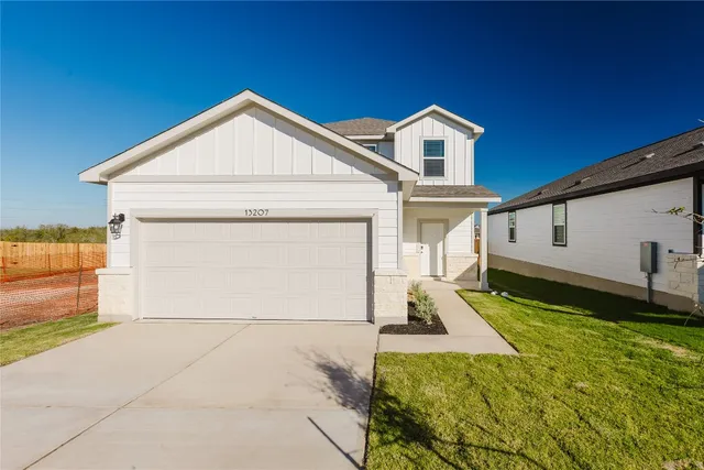 a view of a front of house with yard