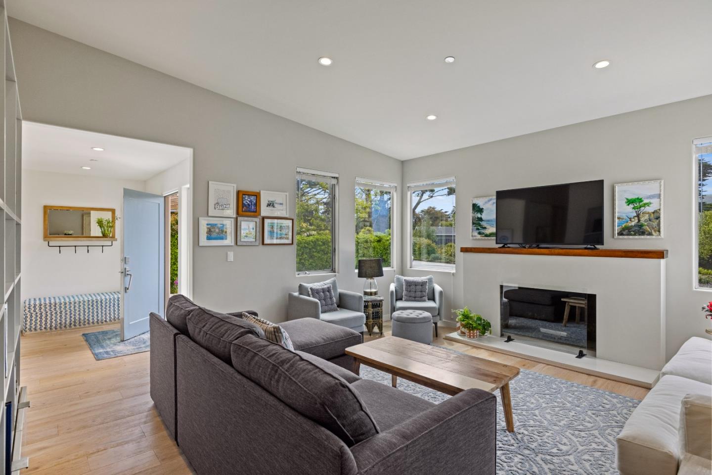 3339 Taylor Road Carmel, CA 93923 - Photo 3 of 27 a living room with furniture a flat screen tv and a fireplace