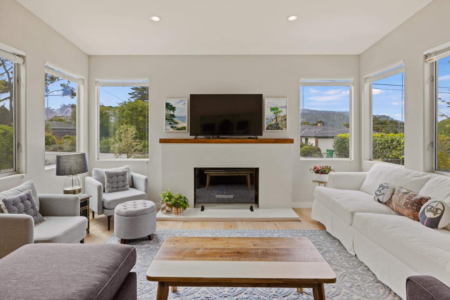 3339 Taylor Road Carmel, CA 93923 - Photo 4 of 27 a living room with furniture a flat screen tv and a fireplace