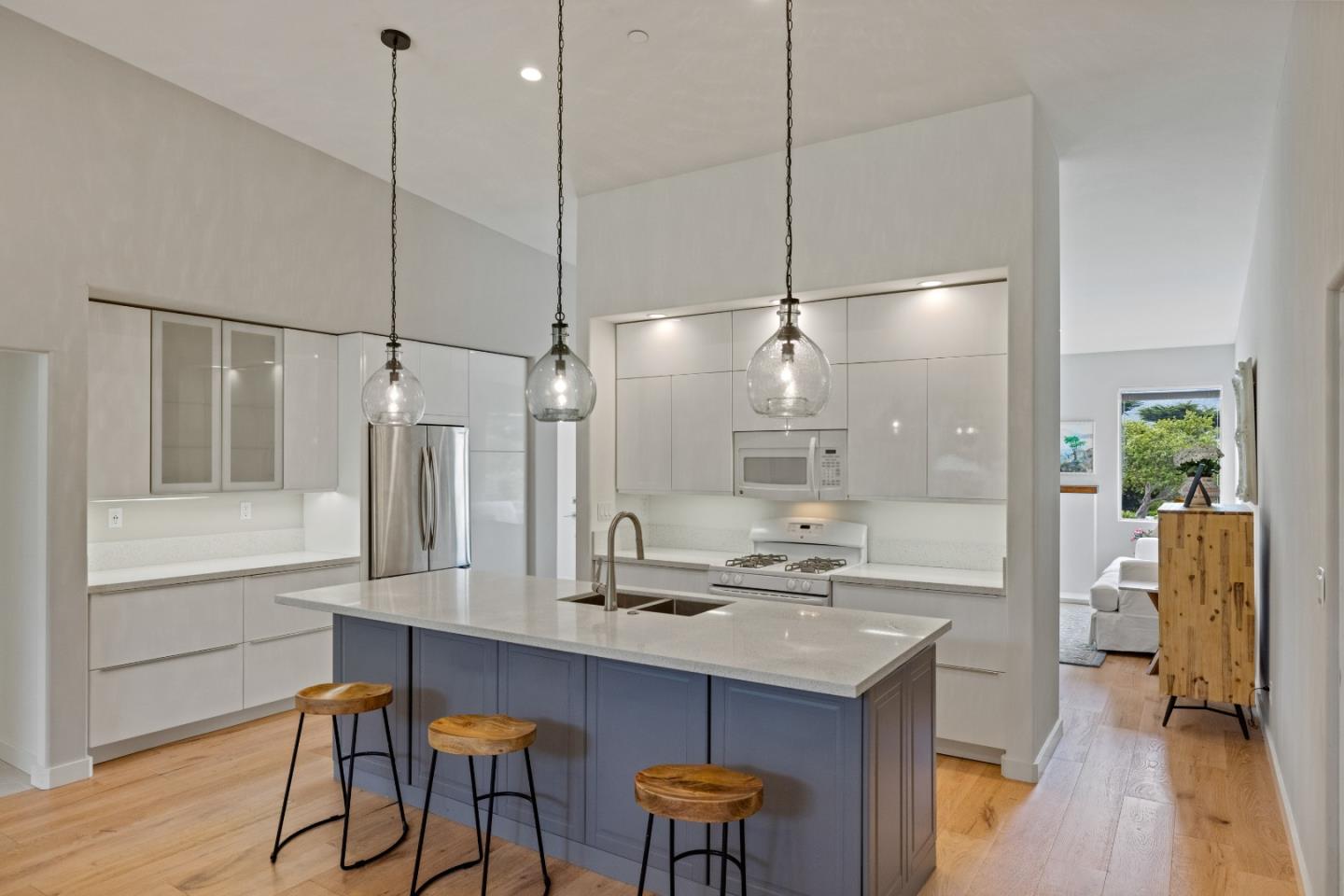 3339 Taylor Road Carmel, CA 93923 - Photo 6 of 27 a kitchen with stainless steel appliances kitchen island a table and chairs in it