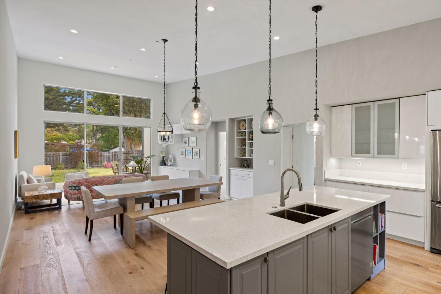 3339 Taylor Road Carmel, CA 93923 - Photo 8 of 27 a kitchen with stainless steel appliances granite countertop a sink a stove a refrigerator and wooden floor