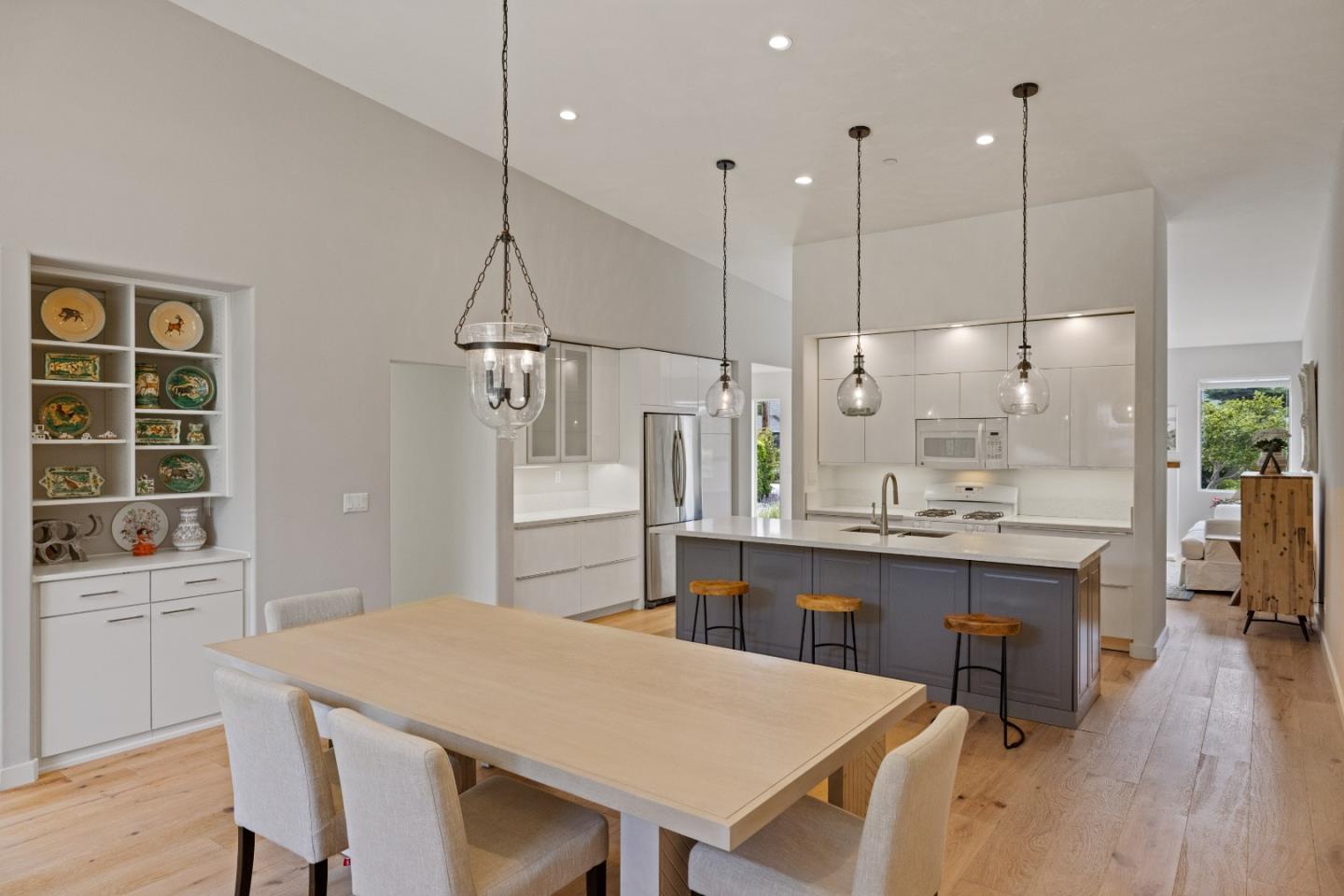 3339 Taylor Road Carmel, CA 93923 - Photo 9 of 27 a kitchen with kitchen island a dining table chairs sink and cabinets