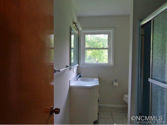 80 Merida Gap Road Canton, NC 28716 - Photo 13 of 18 a bathroom with a sink and a mirror
