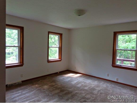 80 Merida Gap Road Canton, NC 28716 - Photo 15 of 18 a view of an empty room with a window