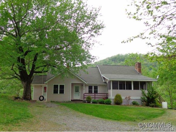 80 Merida Gap Road Canton, NC 28716 - Photo 18 of 18 a front view of a house with a garden and trees