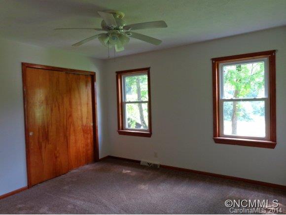 80 Merida Gap Road Canton, NC 28716 - Photo 7 of 18 an empty room with windows and fan