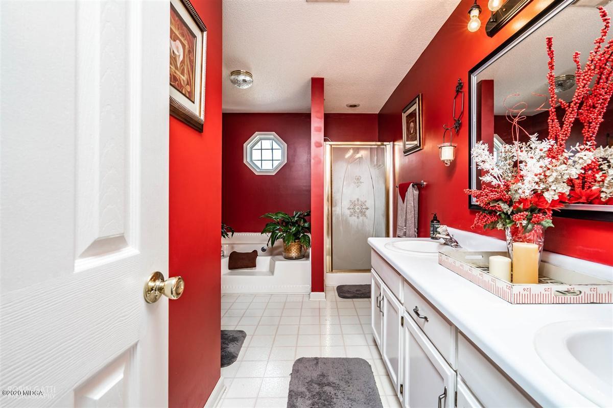 6180 Skipperton Road Macon, GA 31216 - Photo 15 of 37 a bathroom with a sink and a mirror