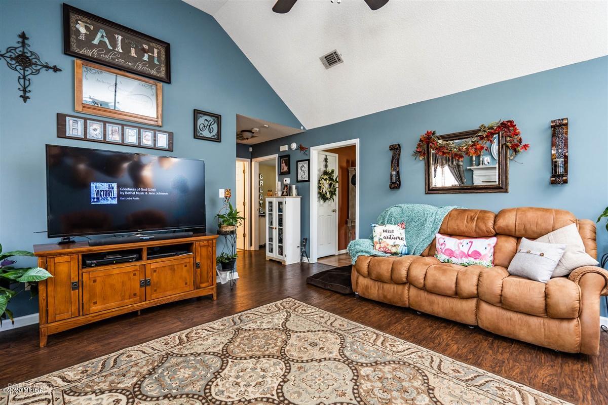 6180 Skipperton Road Macon, GA 31216 - Photo 19 of 37 a living room with furniture and a flat screen tv