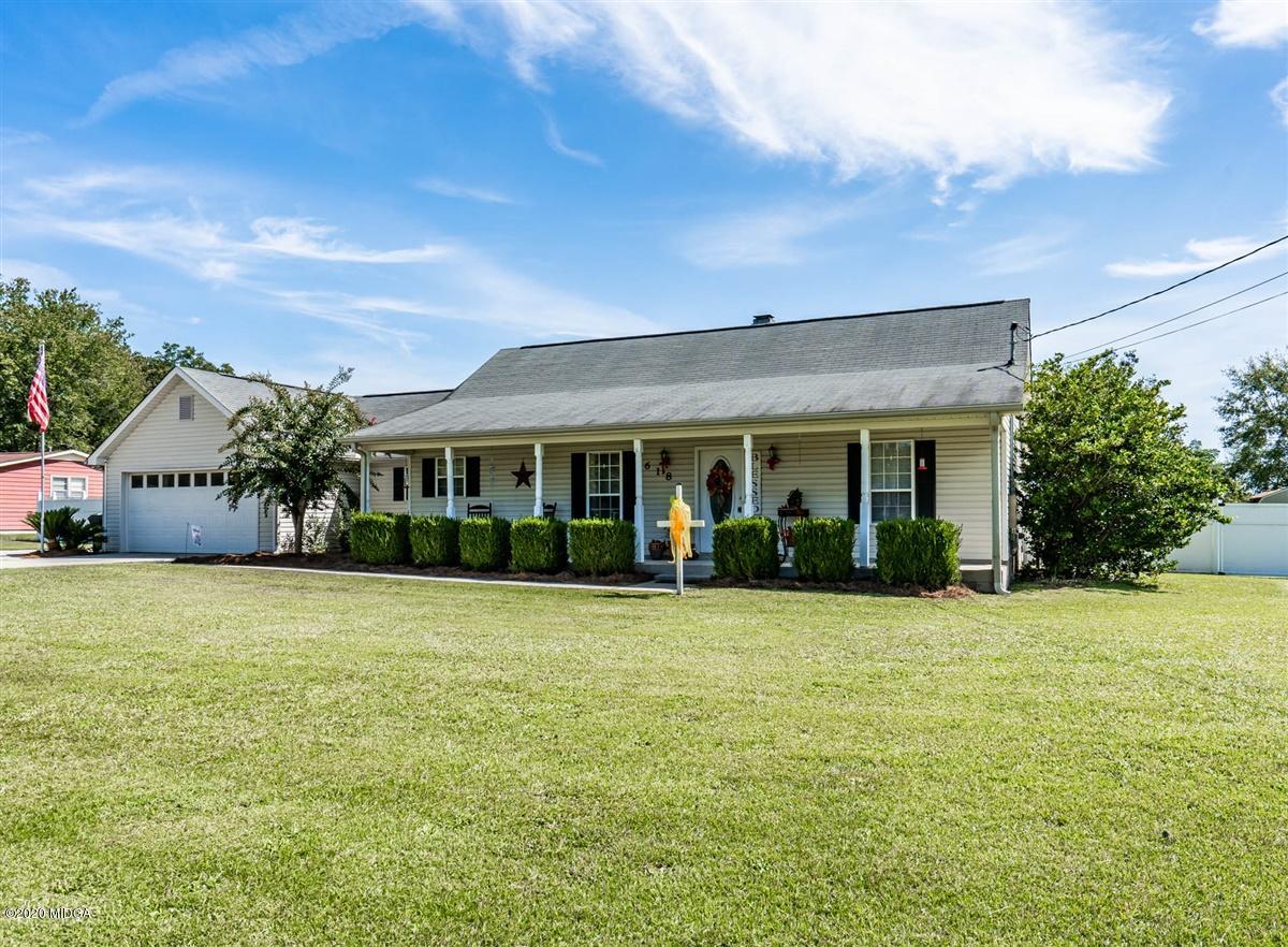 6180 Skipperton Road Macon, GA 31216 - Photo 3 of 37 a front view of house with yard and trees in the background