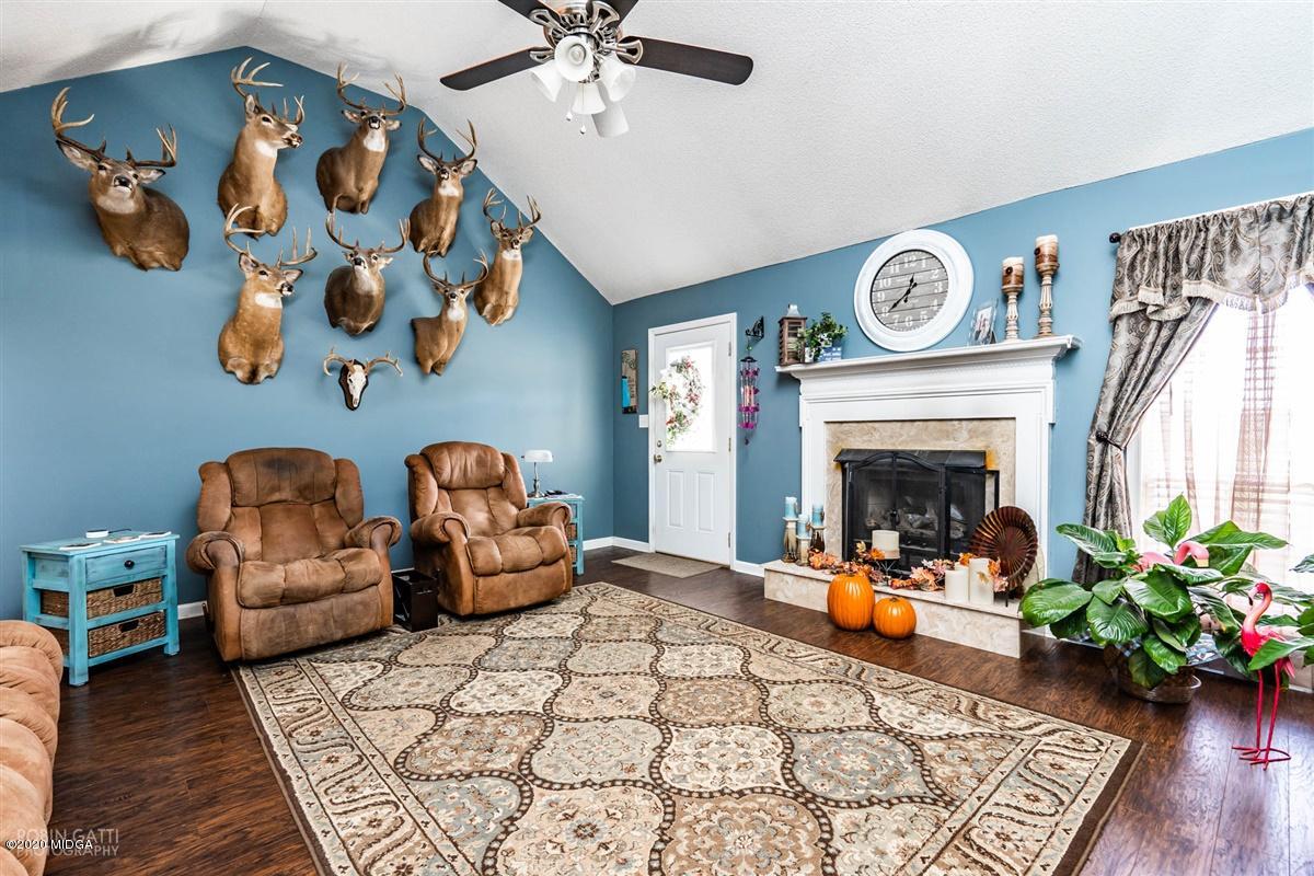 6180 Skipperton Road Macon, GA 31216 - Photo 21 of 37 a living room with furniture and a fireplace